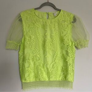 Lacy lime green top with see through cap sleeves.